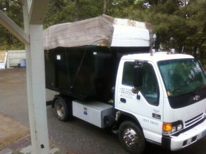 The Palmer Cleanouts & Disposal, LLC truck, loaded up with junk
